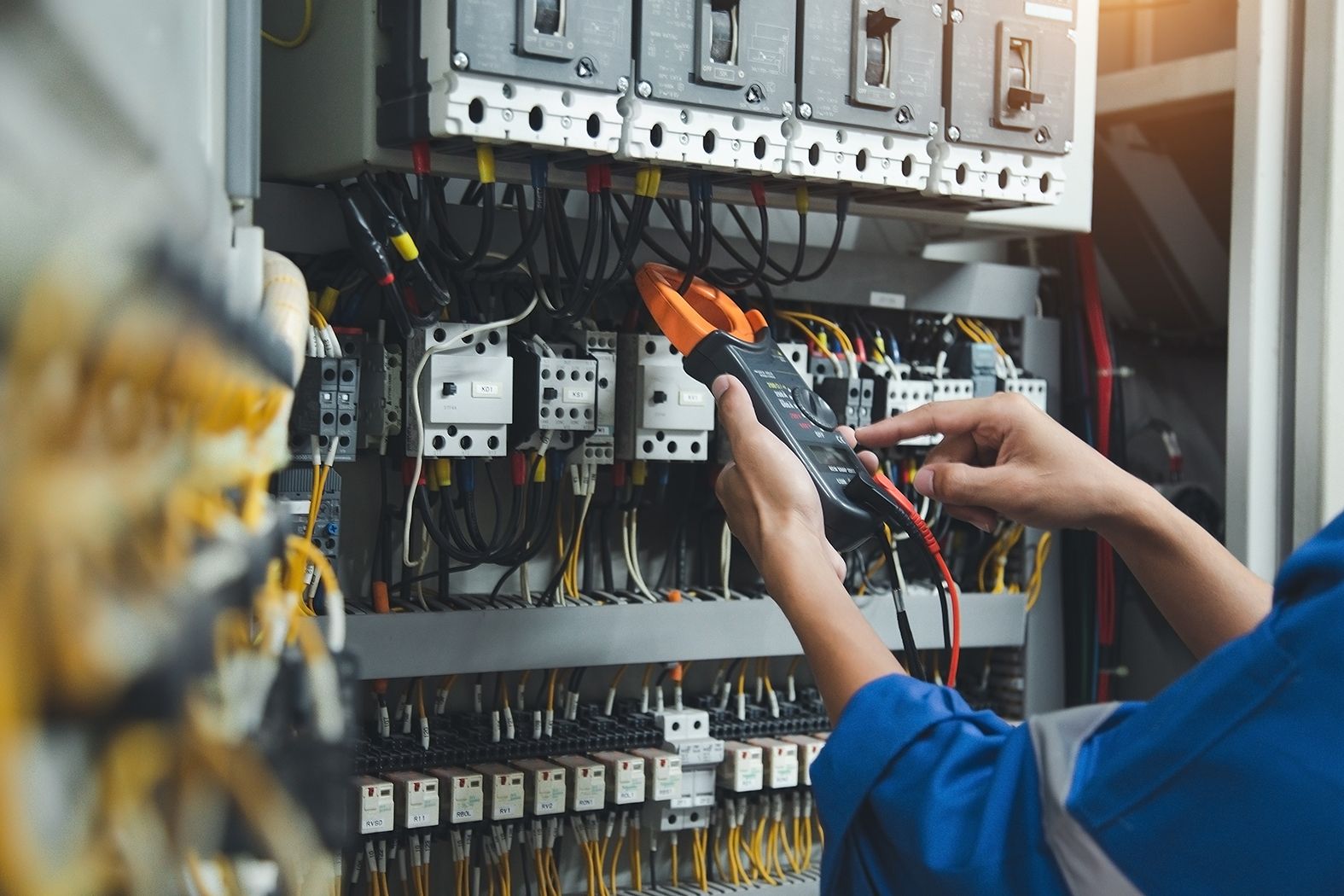 Electrician measurements with multimeter testing current electri